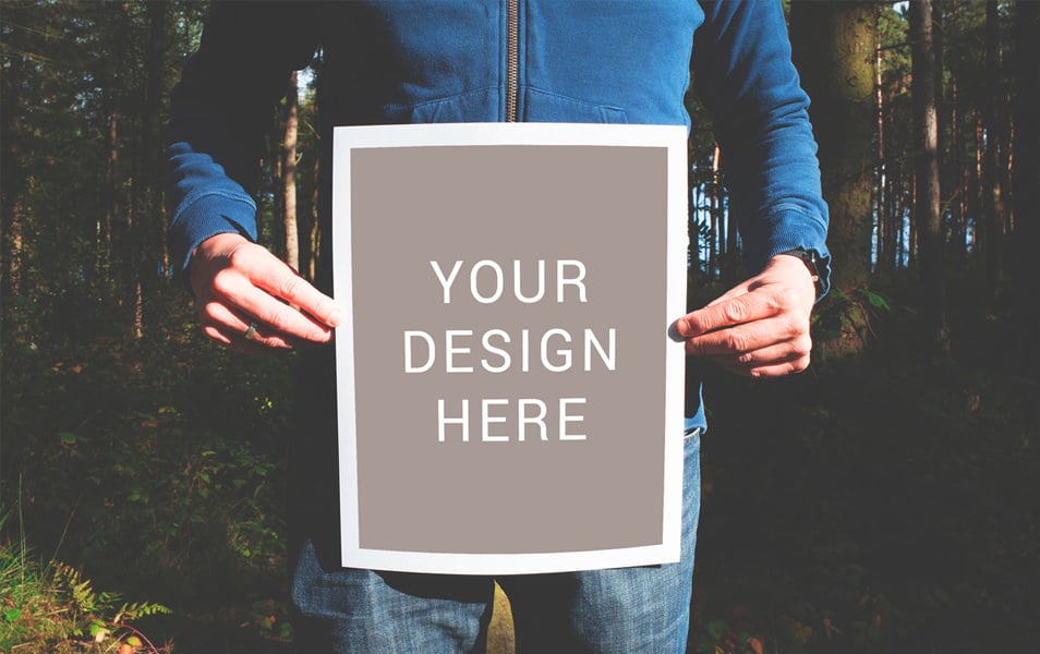 Man Holding Poster Mockup