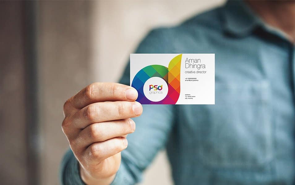 Man Holding Business Card Mockup PSD